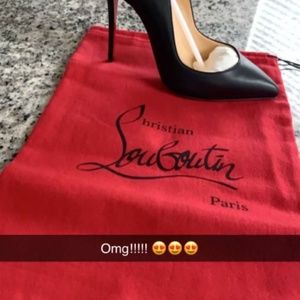 Christian Louboutin Red sole shoes.